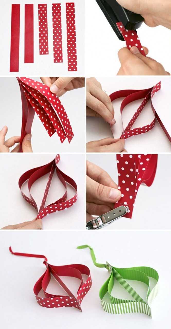 Чтобы сделать при помощи техники оригами новогодние игрушки на елку из бумаги своими руками такие как на фото следуйте детальному описанию и практическим советам